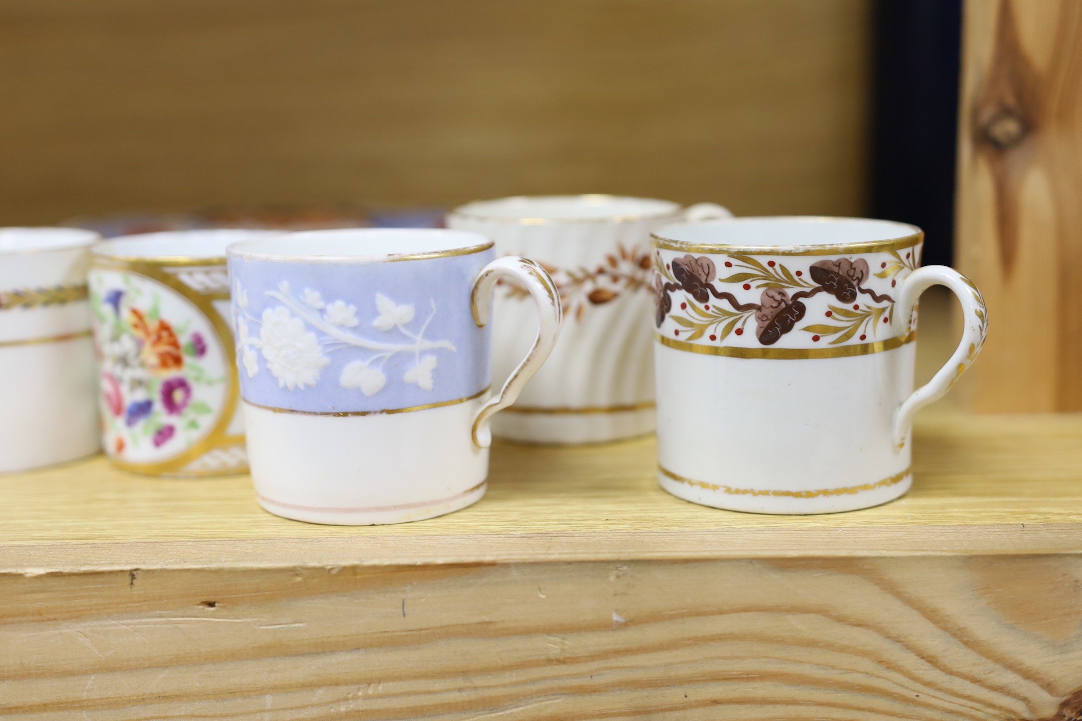 Seven early 19th century coffee cans and three Ridgway Imari style plates, plates 23 cms diameter